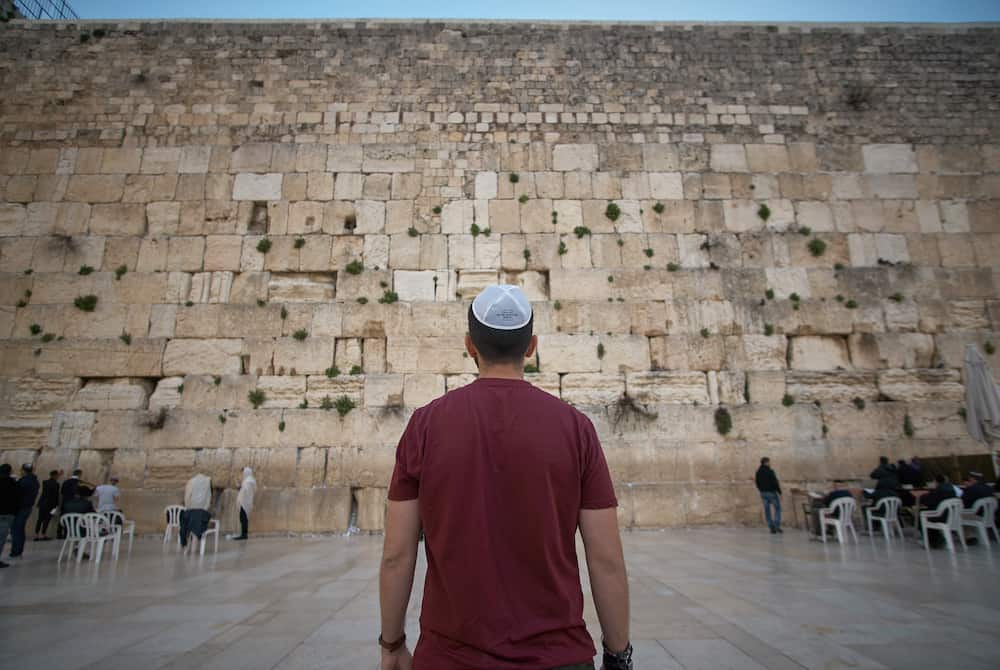 A man in a kippah in front of the Western Wall (Jerusalem)